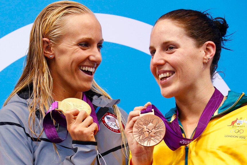 LtoR Dana Vollmer of the US and Australia's Alicia Coutts pose with their gold and bronze medals.