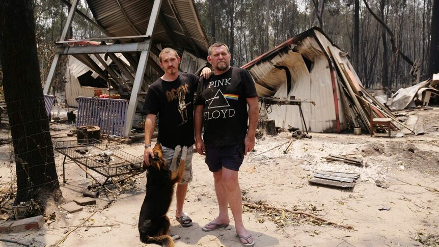 Douglas Wood (R), pictured here with his son Jack, watched his home burn down.