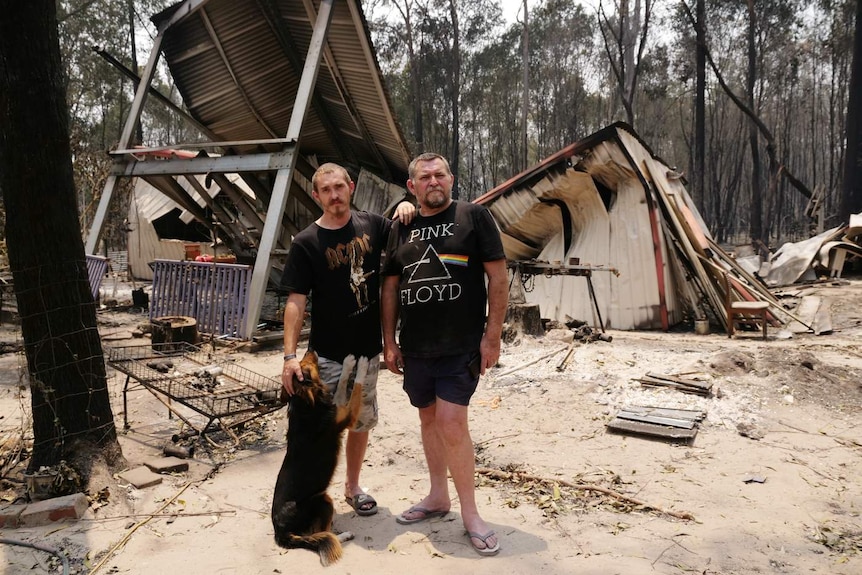 Douglas Wood (R), pictured here with his son Jack, watched his home burn down.