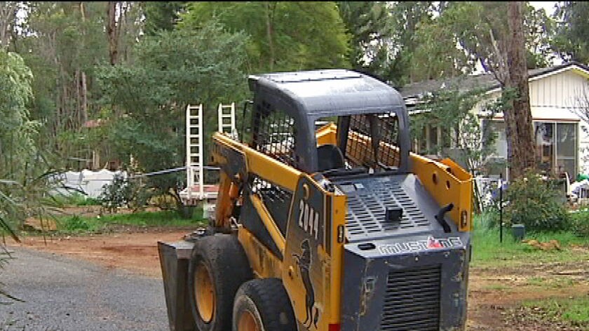 Bobcat used to smash Perth hills house