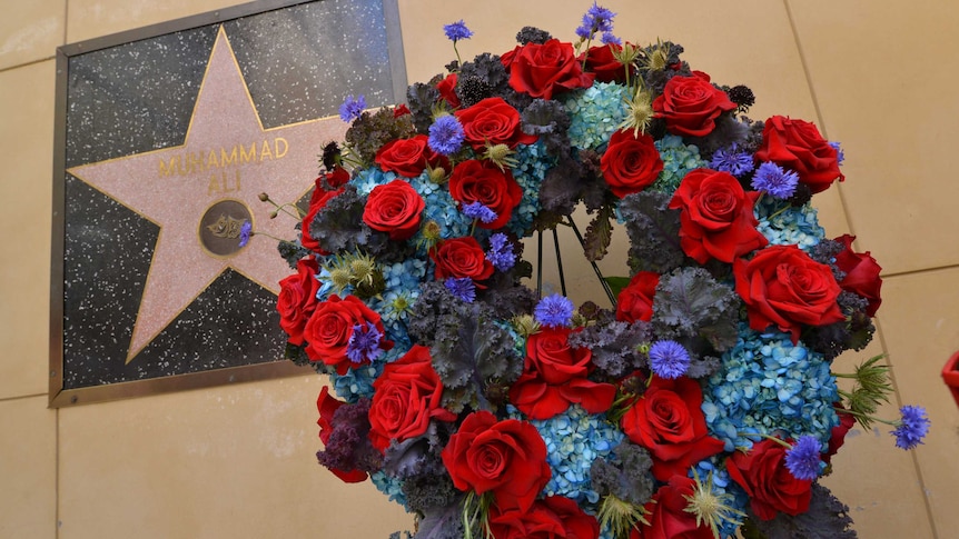 A wreath stands next to Muhammad Ali's star on Hollywood Boulevard