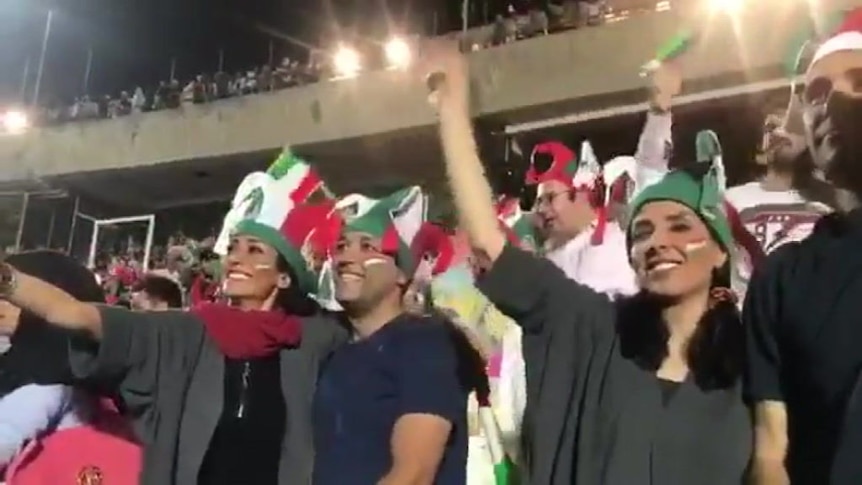 Iranian women watch a live screening of a World Cup match in Tehran's Azadi Stadium.