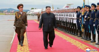 North Korea's leader Kim Jong-un attends a welcoming ceremony after arriving in Singapore.