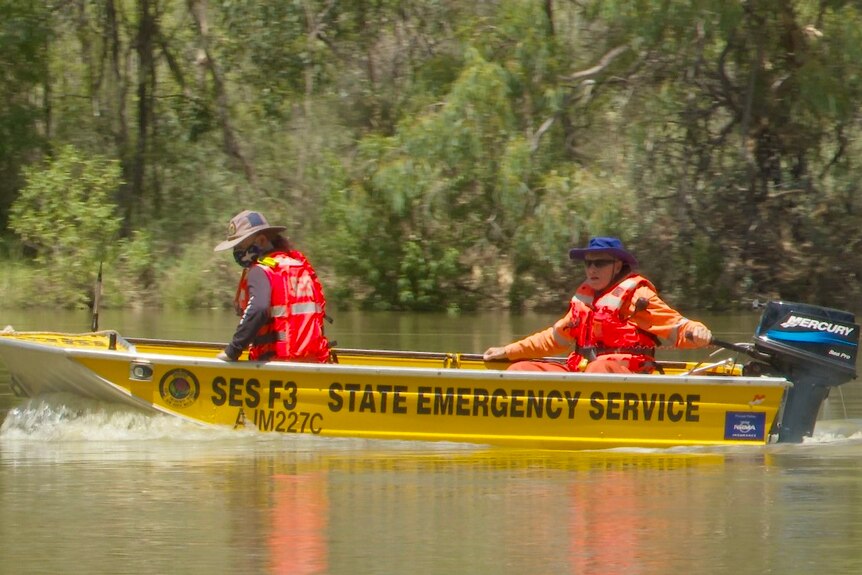 State Emergency Services in a boat along the Darling River. 