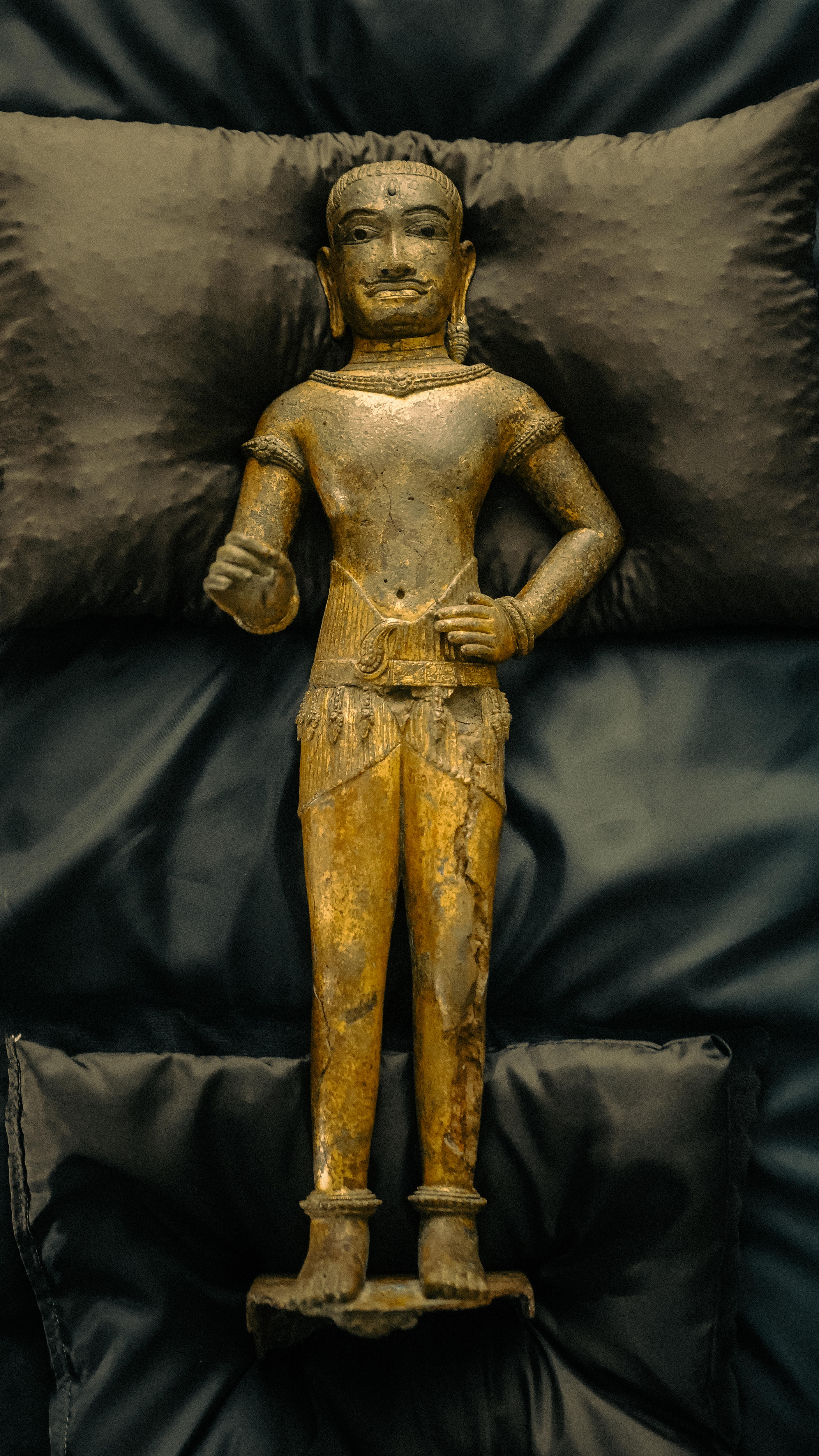 A statue on a pillow.