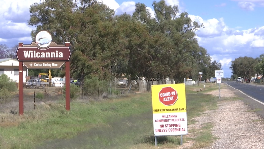 The pandemic sign placed near the Wilcannia entrance sign asking travellers to only stop if essential