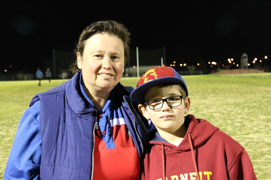 Jodie Donald poses with her arm around her son Lucas.