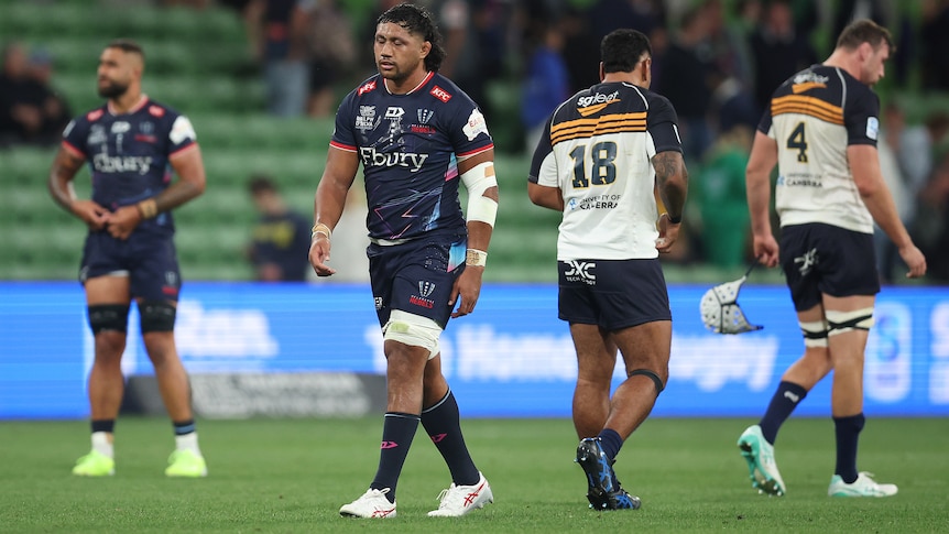 Melbourne Rebels players show their disappointment after losing to the Brumbies.
