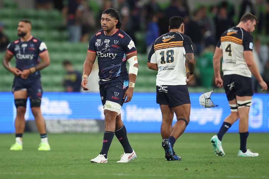 Melbourne Rebels players show their disappointment after losing to the Brumbies.