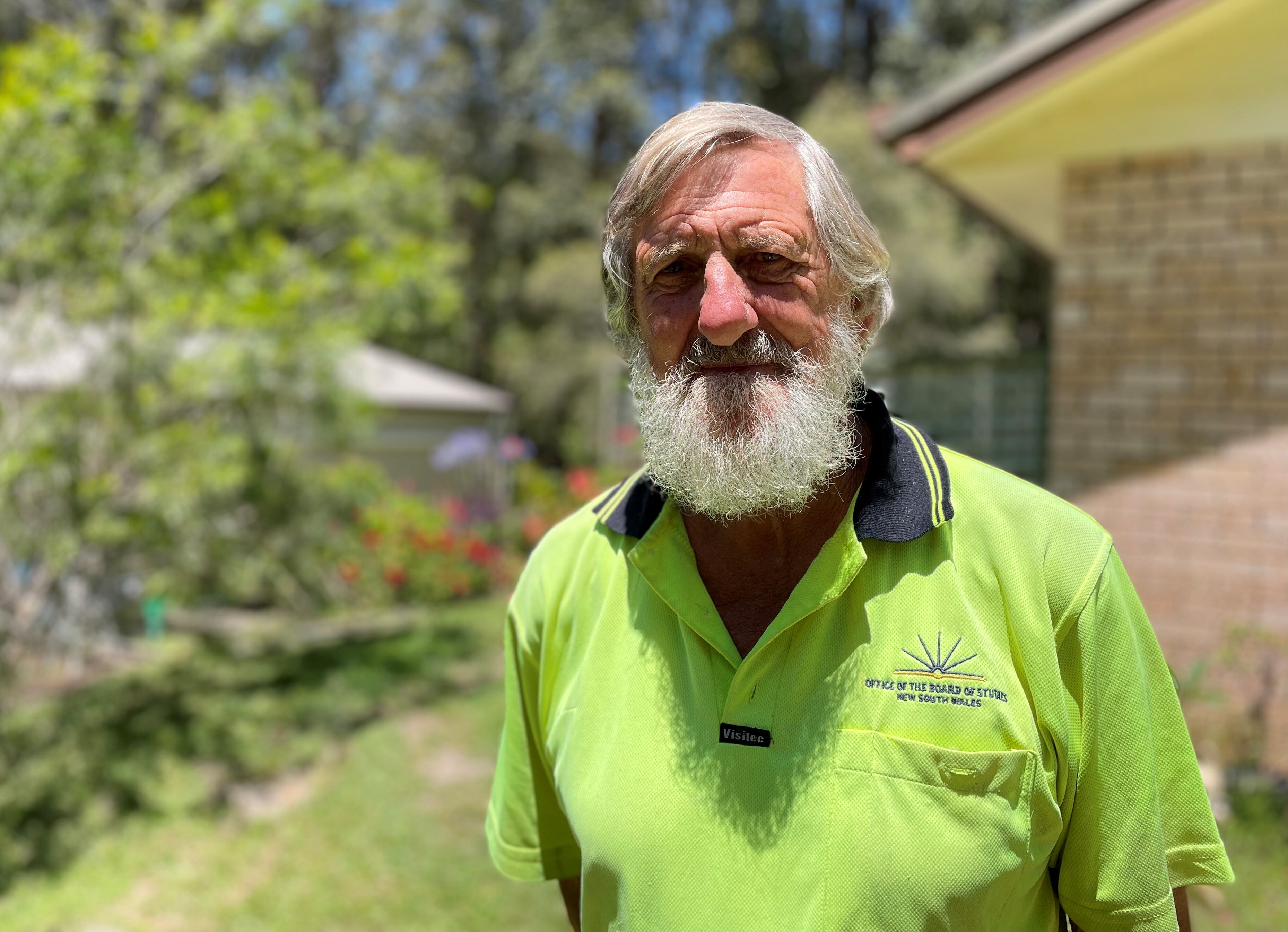 a man in a high ves shirt