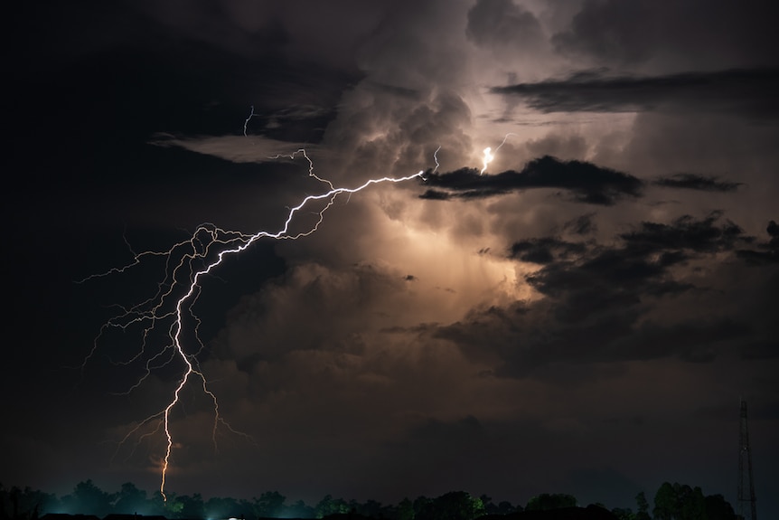 A stream of lightning coming out of a cloud. 