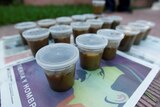 Plastic pots filled with faeces called Poopootovs lined up ready to be thrown at police in Venezuela.