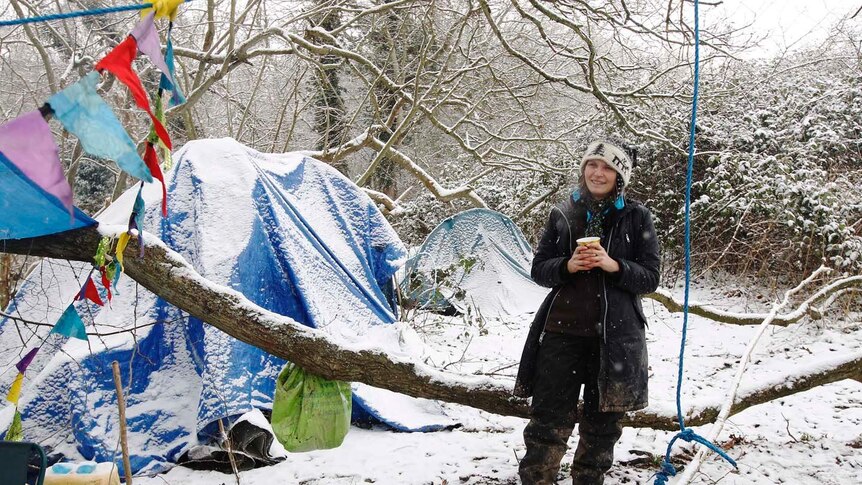 An activist warms up with a cup of tea