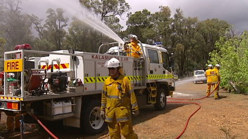 Volunteer firefighters and truck at launch of Bushfire Awareness Week.