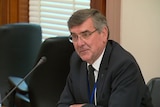 Peter Lochert gives evidence to a committee hearing at Victorian Parliament.