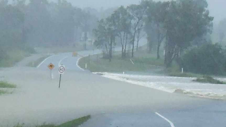 Flooding cuts off a road in Yeppoon