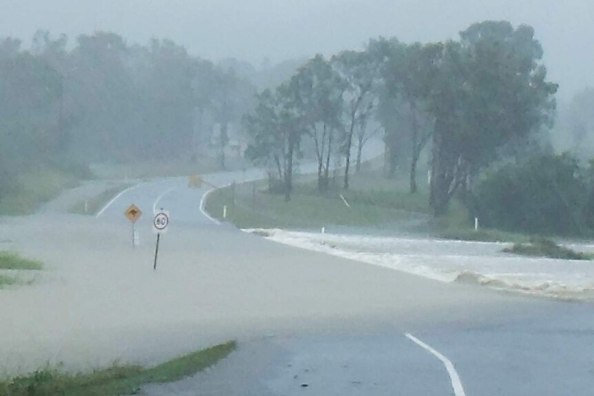 Flooding cuts off a road in Yeppoon