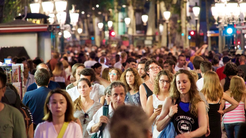 People fill the Las ramblas pedestrian strip following the attack