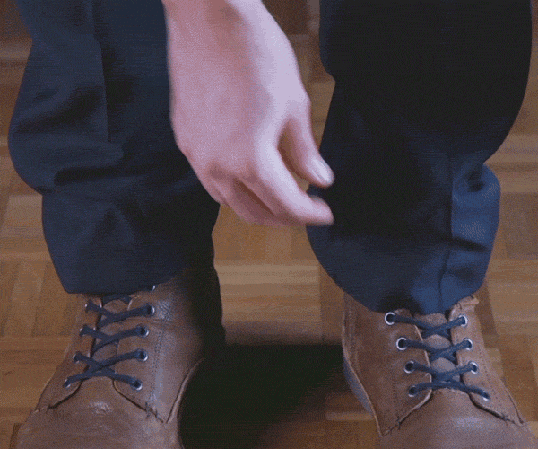 Gif of folding trousers inwards to the desired length prior to hemming.