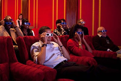 President Barack Obama and First Lady Michelle Obama wear 3-D glasses while watching the Super Bowl at a Super Bowl Party in ...