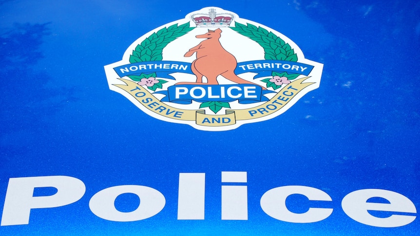 Northern Territory police emblem on police car.