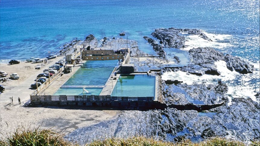 Large swimming pool cut into oceanside rocks