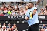 Australia's Nick Kyrgios returns to Alexandr Dolgopolov at Brisbane International in January 2018.