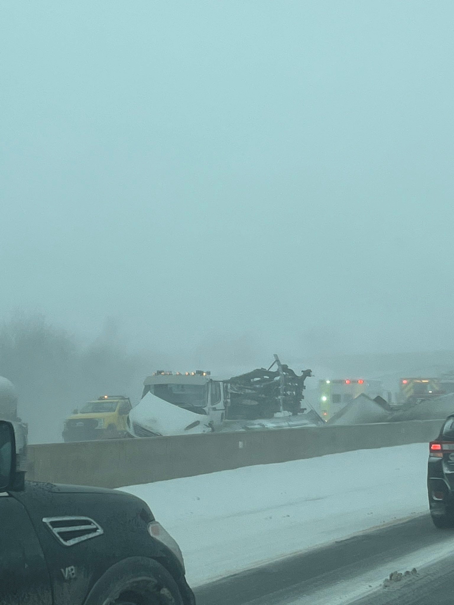 Numerous crashed cars on a road