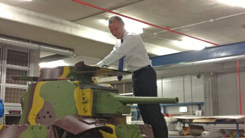 Memorial director Brendan Nelson takes a close look at a Japanese Type 95 Ha-Go Light Tank brought back to Australia after WWII.