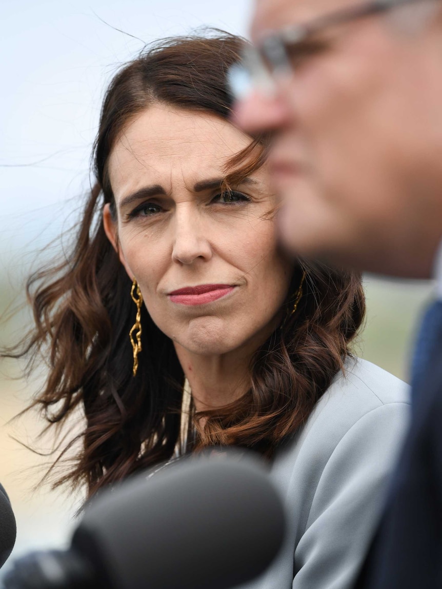 New Zealand Prime Minister Jacinda Ardern looks at Australian Prime Minister Scott Morrison.