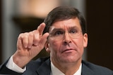 New US Secretary of Defence Mark Esper raises his hand, testifying before a Senate Armed Services Committee