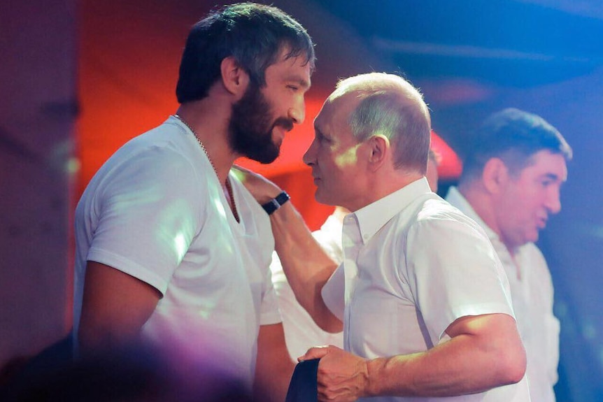 Putin whispering into Overchkin
