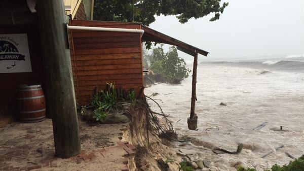 Water washes up over the top of a pathway on Great Keppel Island