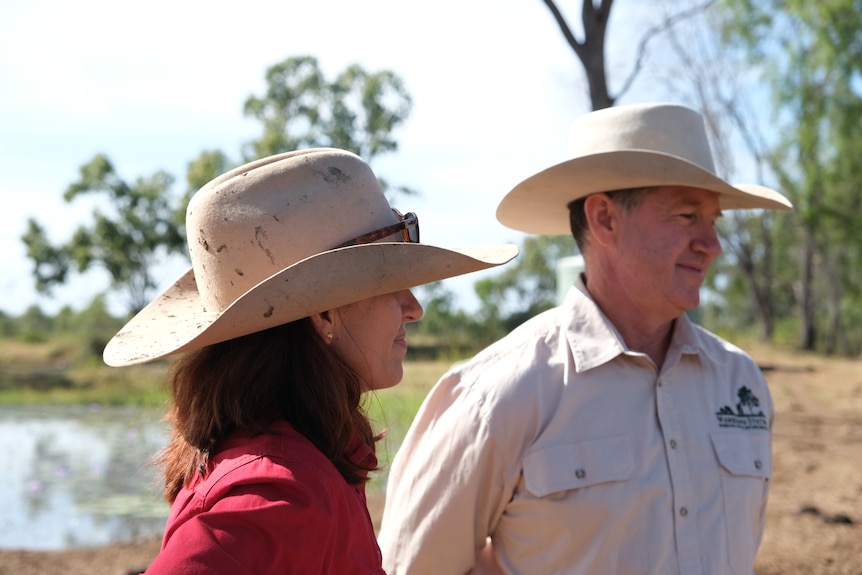 Michelle and Michael Lyons both with wide brim country hates, side profiles