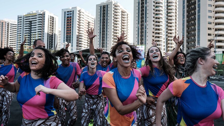 Dancers rehearse before welcoming athletes at Olympic Village