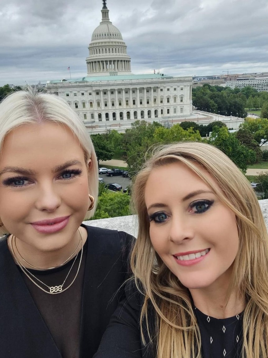 Two women standing in front of the US Capitol