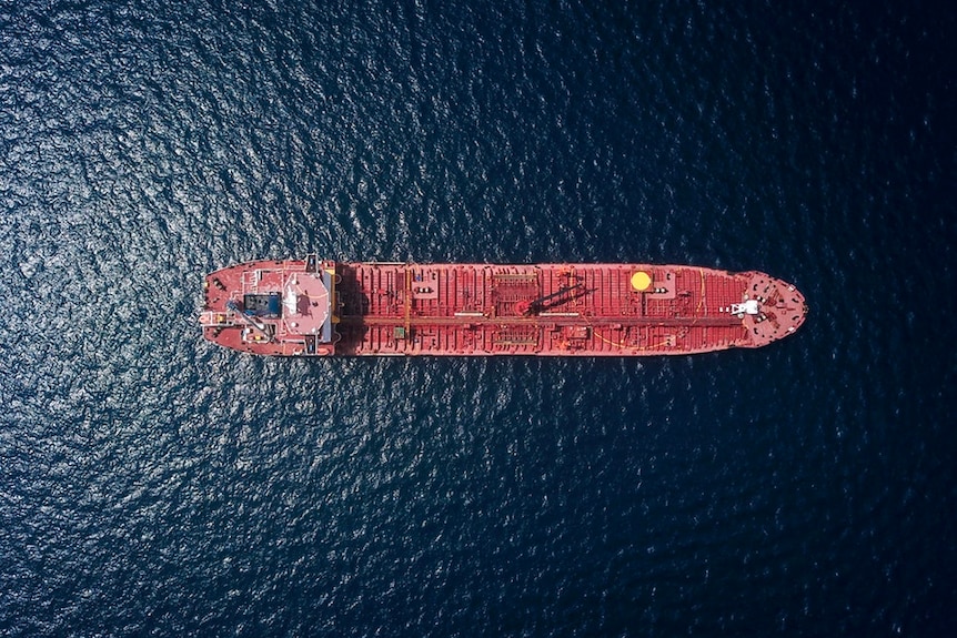 An aerial view looking down on a container ship.