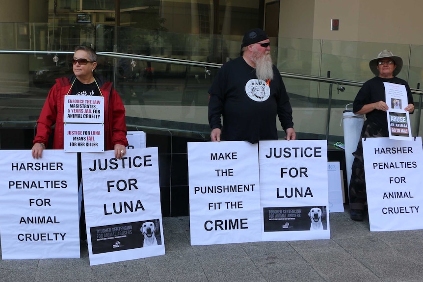 A group of animal rights protesters holding placards reading "Justice for Luna" and "Make the Punishment Fit the Crime".