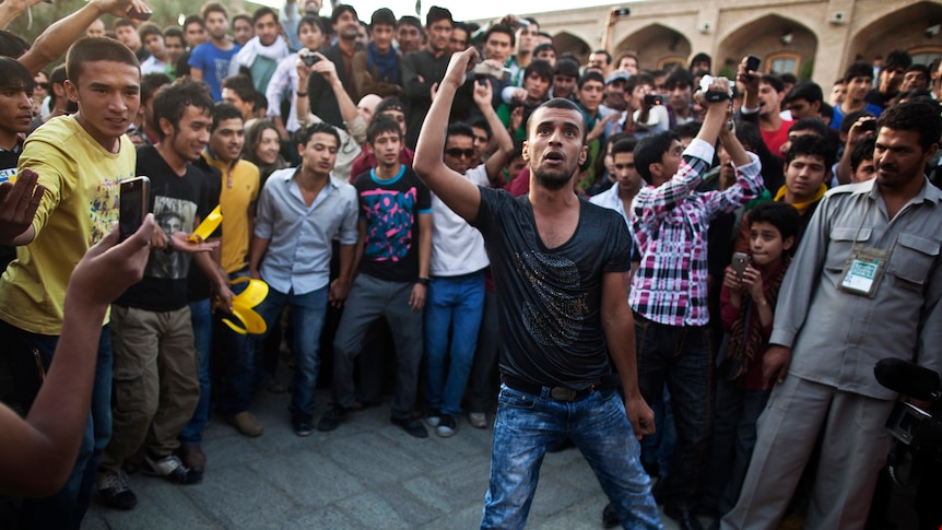 An Afghan youth from the audience dances during Sound Central in Kabul on October 1, 2011.