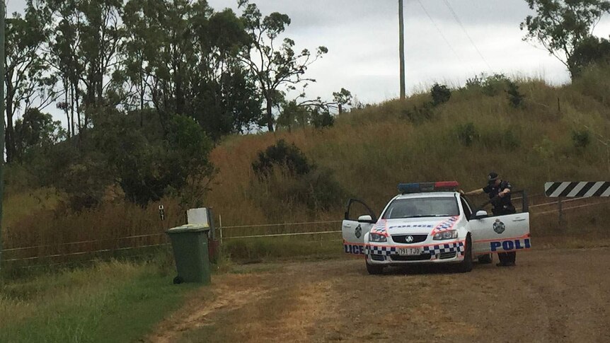 Police remain at the property in northern Rockhampton where the bodies of two men were discovered