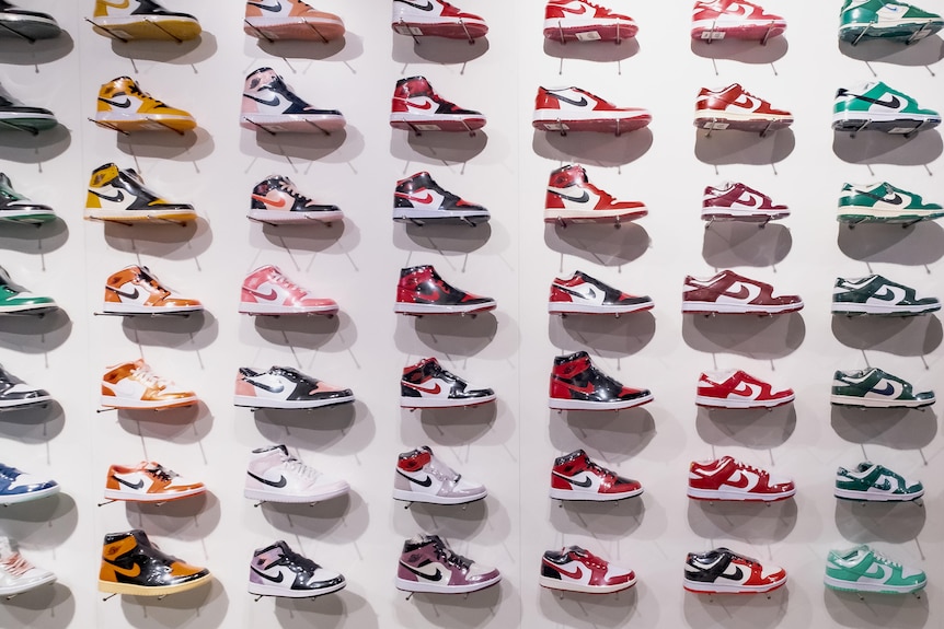 A wall of Nike sneakers sealed in plastic wrapping.