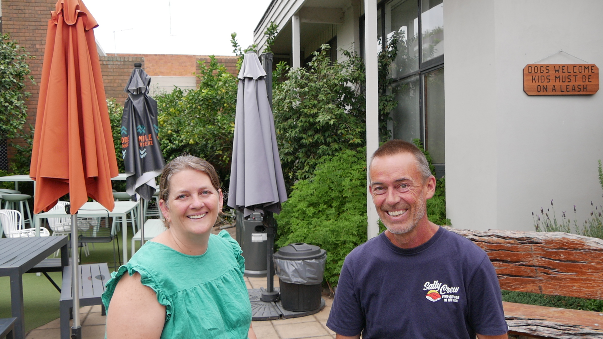 couple smiling at camera at backpackers hostel