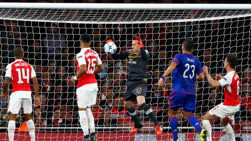 Arsenal goalkeeper David Ospina scores an own goal against Olympiakos in the Champions League.