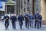 Seven police officers walking together in Sydney