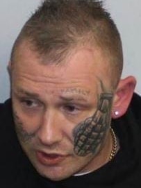 man with face tattoos.