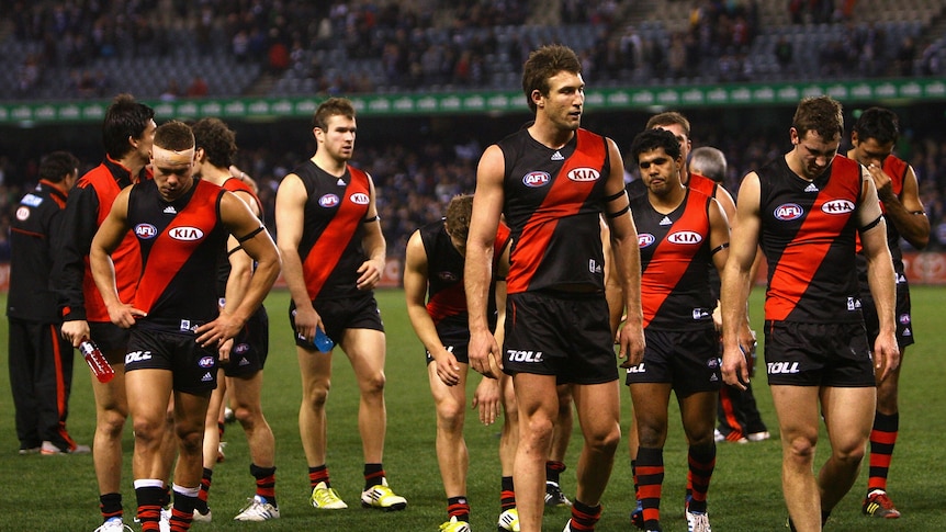 Harsh lesson ... The Bombers walk off after their loss to the Cats