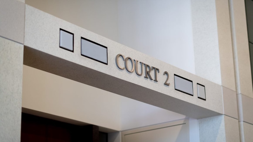 Photo taken of a sign outside a courtroom saying "court 2"