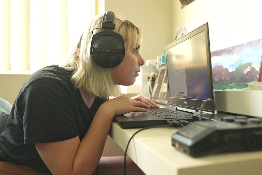 Lily Mitchell editing a sound recording on her computer