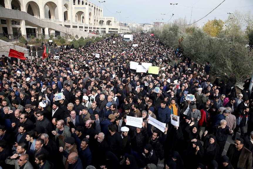 Iranian demonstrators attend a protest