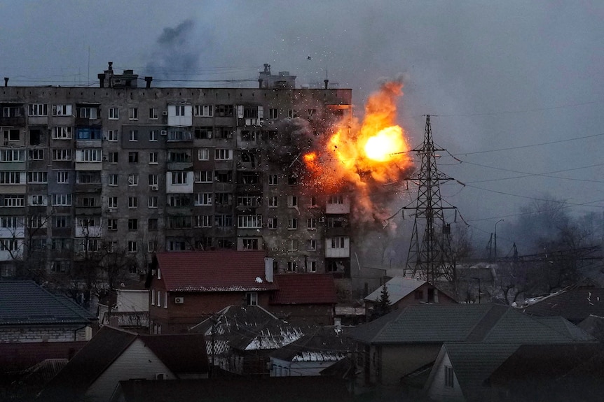 An explosion is seen in an apartment building.